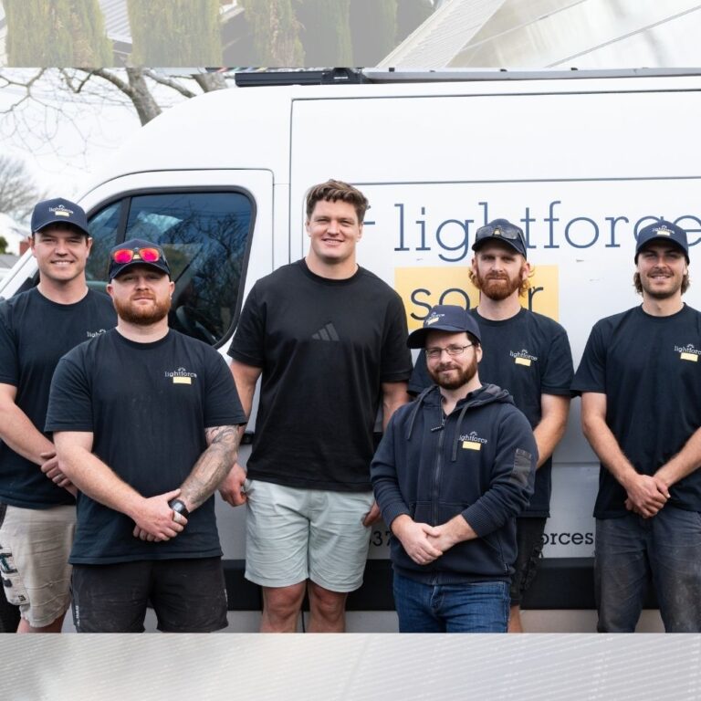 Group photo with rugby player scott barrett after solar installation