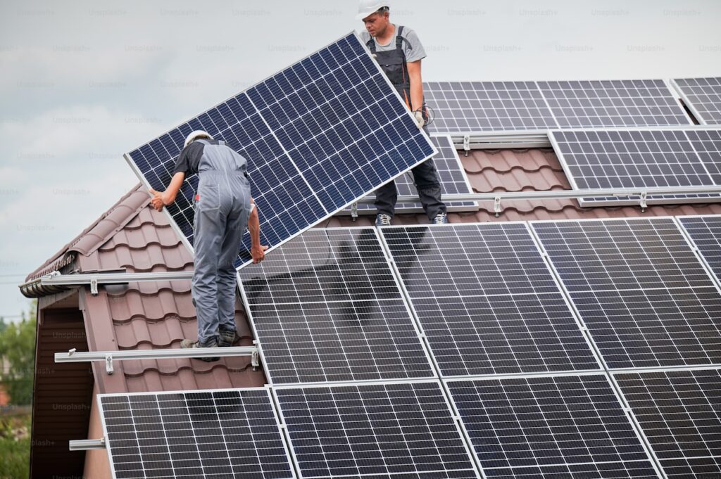 Lightforce team setting up solar panels on a residential roof